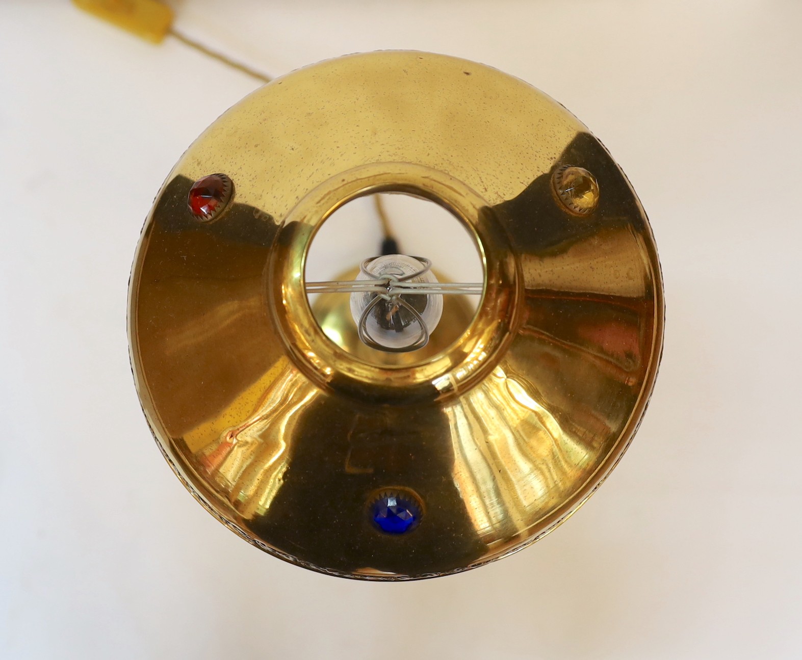 An early 20th century English brass table lamp, the jewelled shade with glass bead fringe, height 45cm